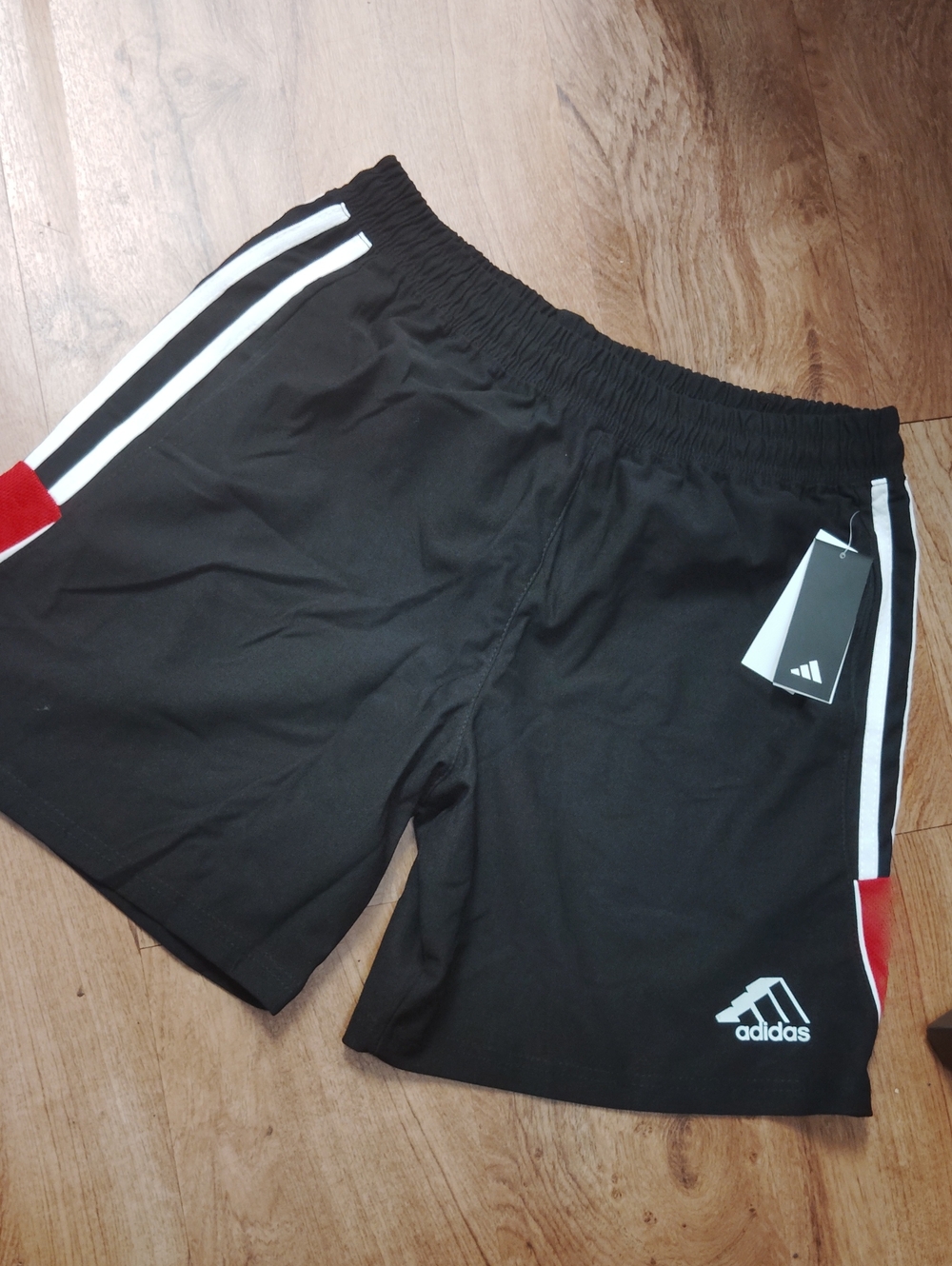 adidas Men’s Black Athletic Shorts with White Stripes and Red Accents, Pockets.